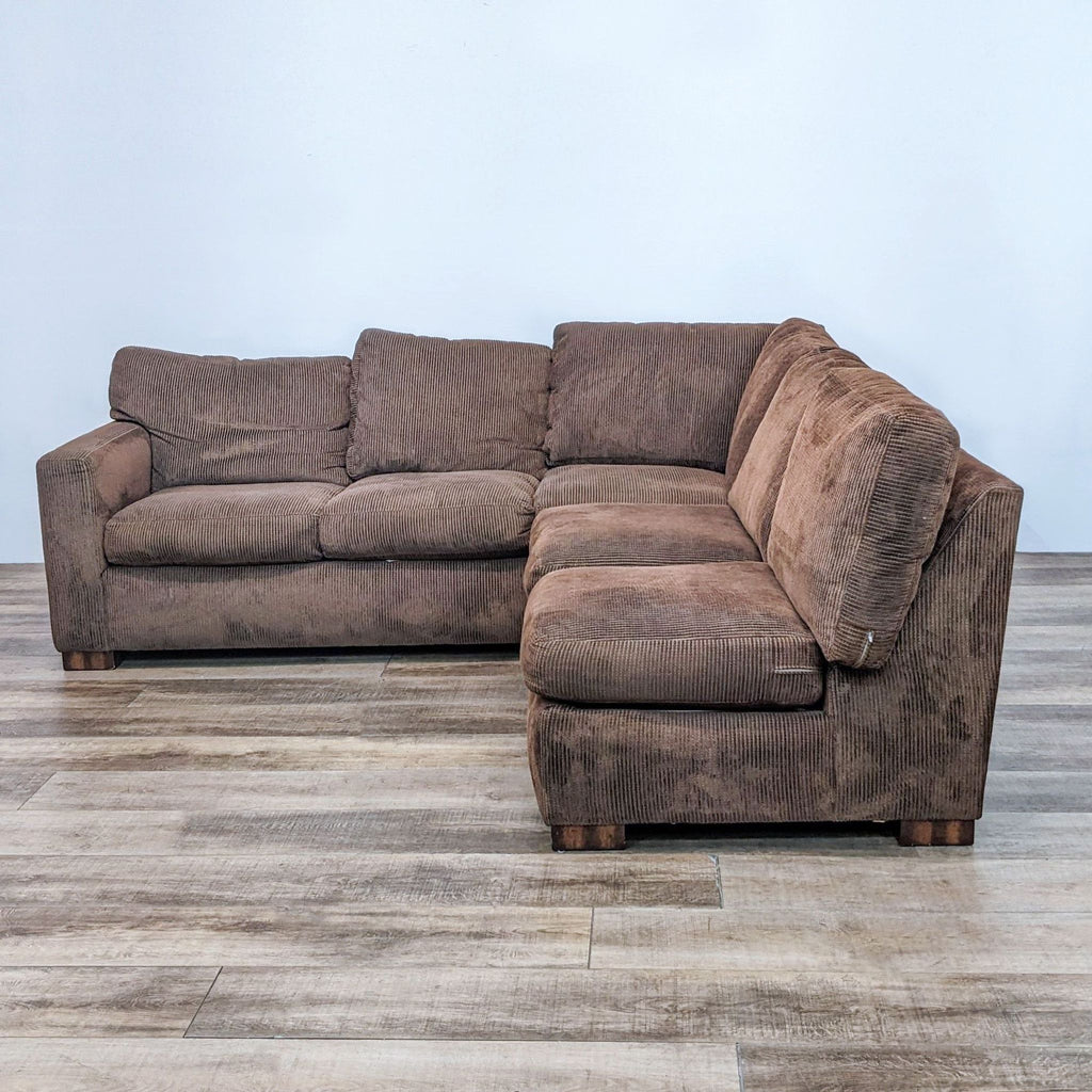 Two-piece brown sectional sofa with comfortable seating and sleek design.