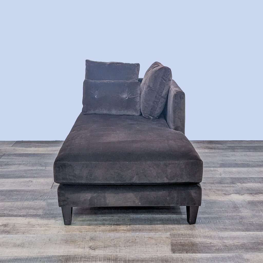 Sophisticated brown fabric chaise with dark finish wood legs.
