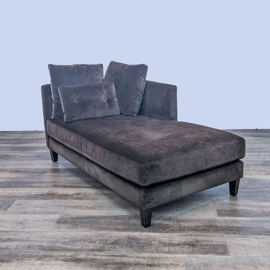 Contemporary brown chaise featuring plush fabric and dark wood legs.