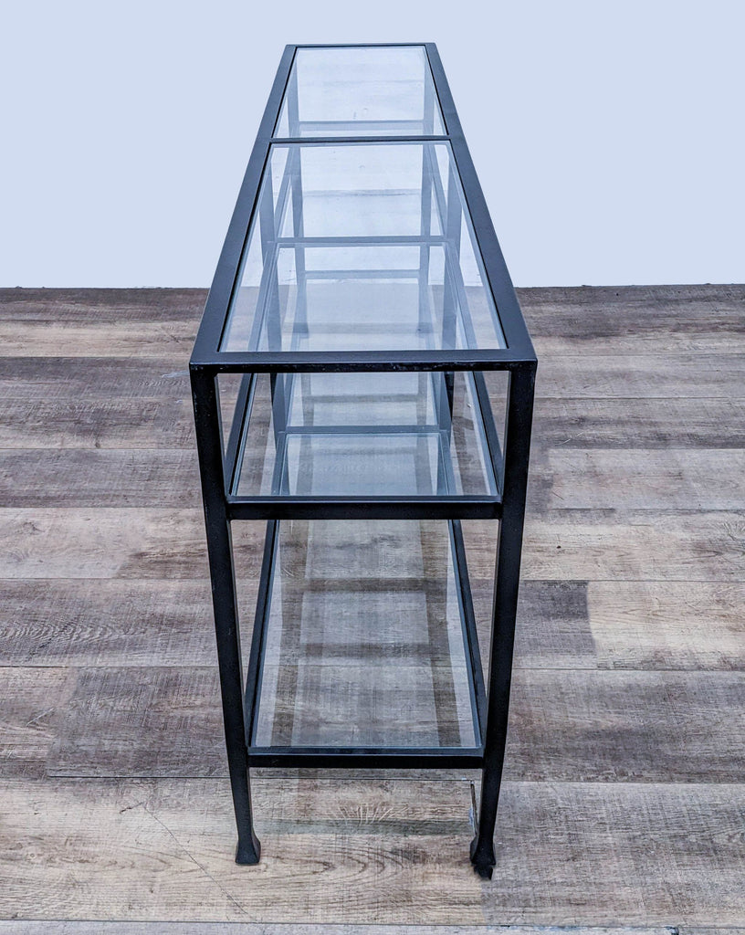 Pottery Barn console table, featuring tempered glass and blackened bronze wrought iron design.