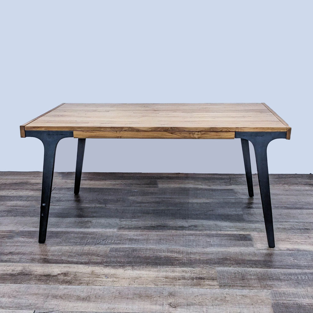 Lakin dining table with aluminum legs and oak top. 