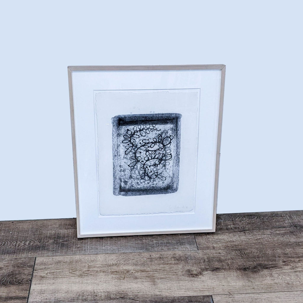 Framed abstract print with swirling lines and patterns by Reperch. Neutral background.  