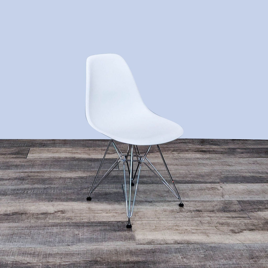 Front view of Eames dining chair with sleek chrome wire base.