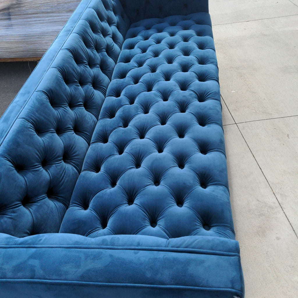 1. Modern 3-seat sofa with plush cushions, ideal for a contemporary living room setting.