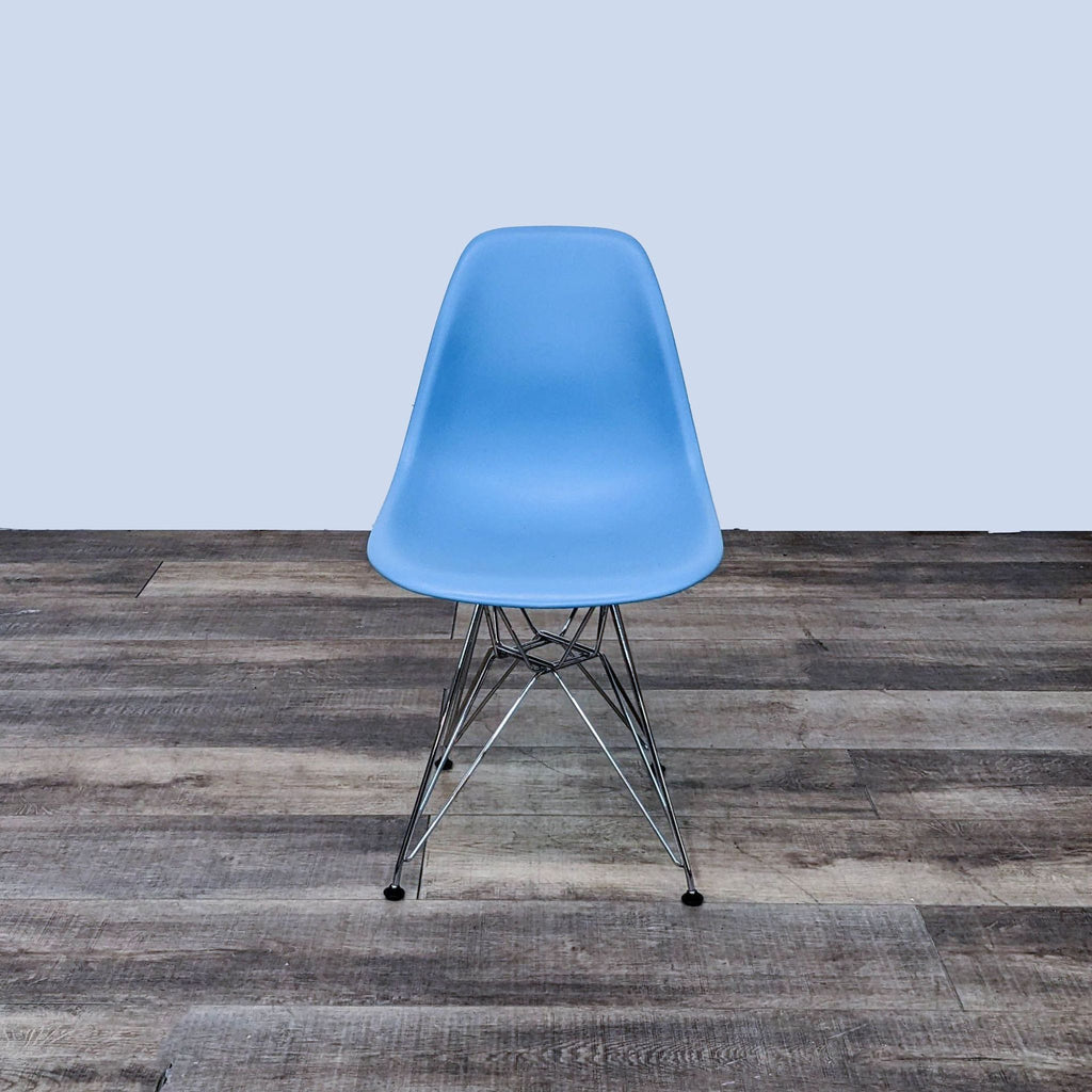 Herman Miller's blue Eames chair with flexible back and waterfall edge, front view.