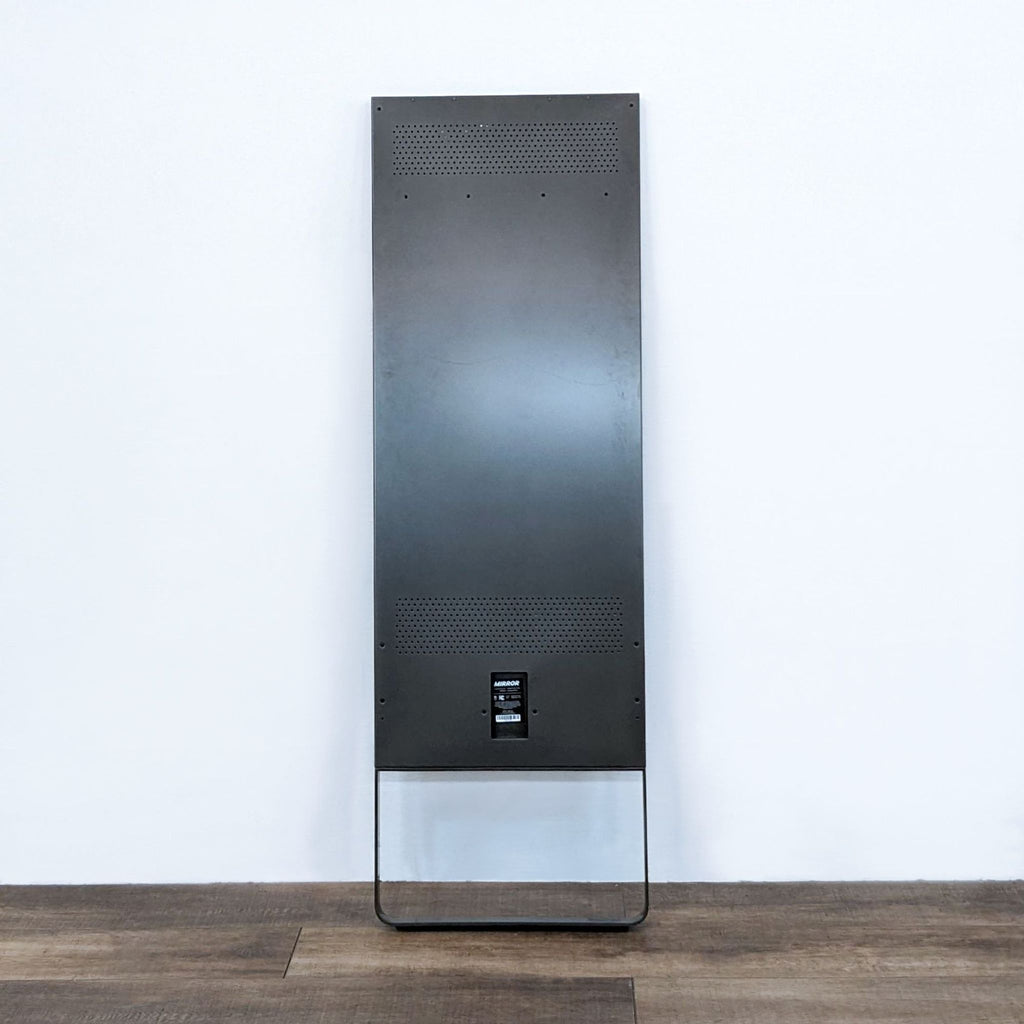Back view of Lululemon Studio Fitness Mirror, showcasing its sleek design and stand.