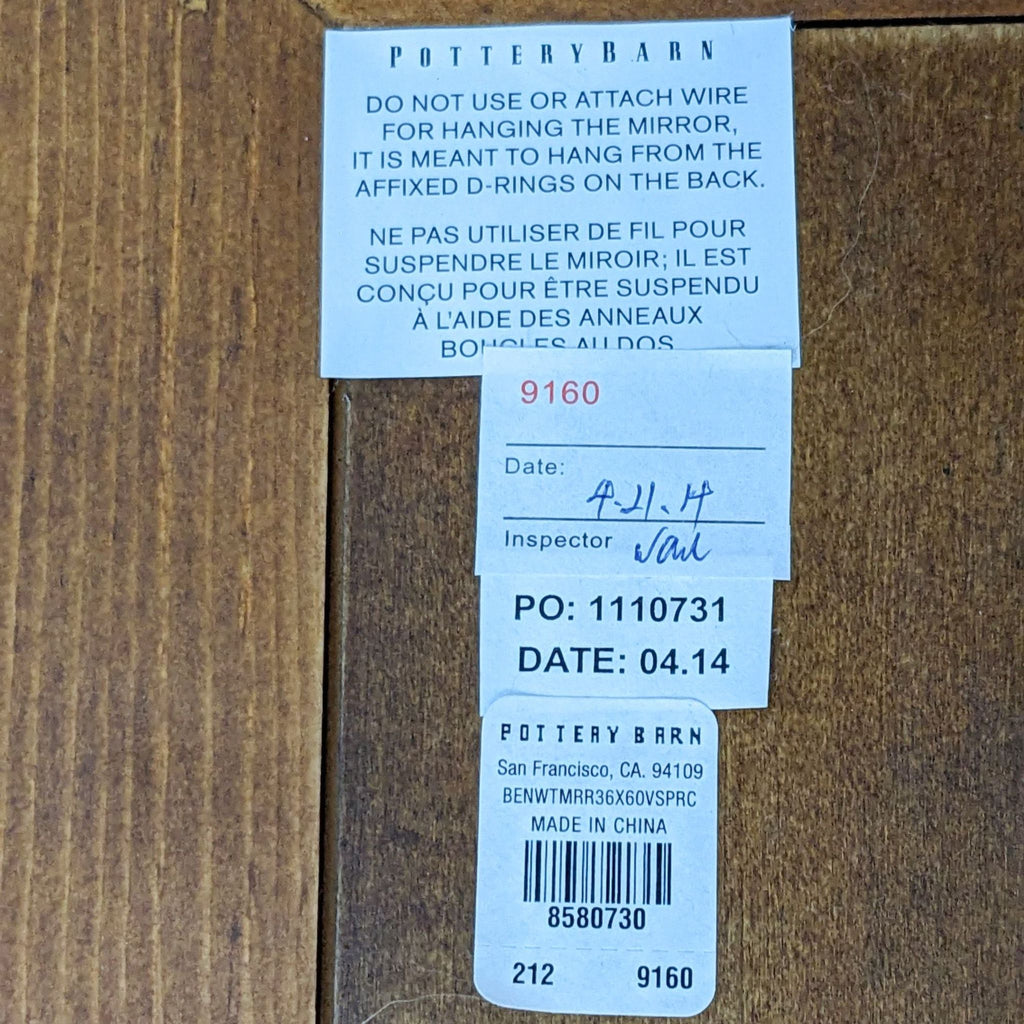 Back label of Pottery Barn mirror with mounting instructions.