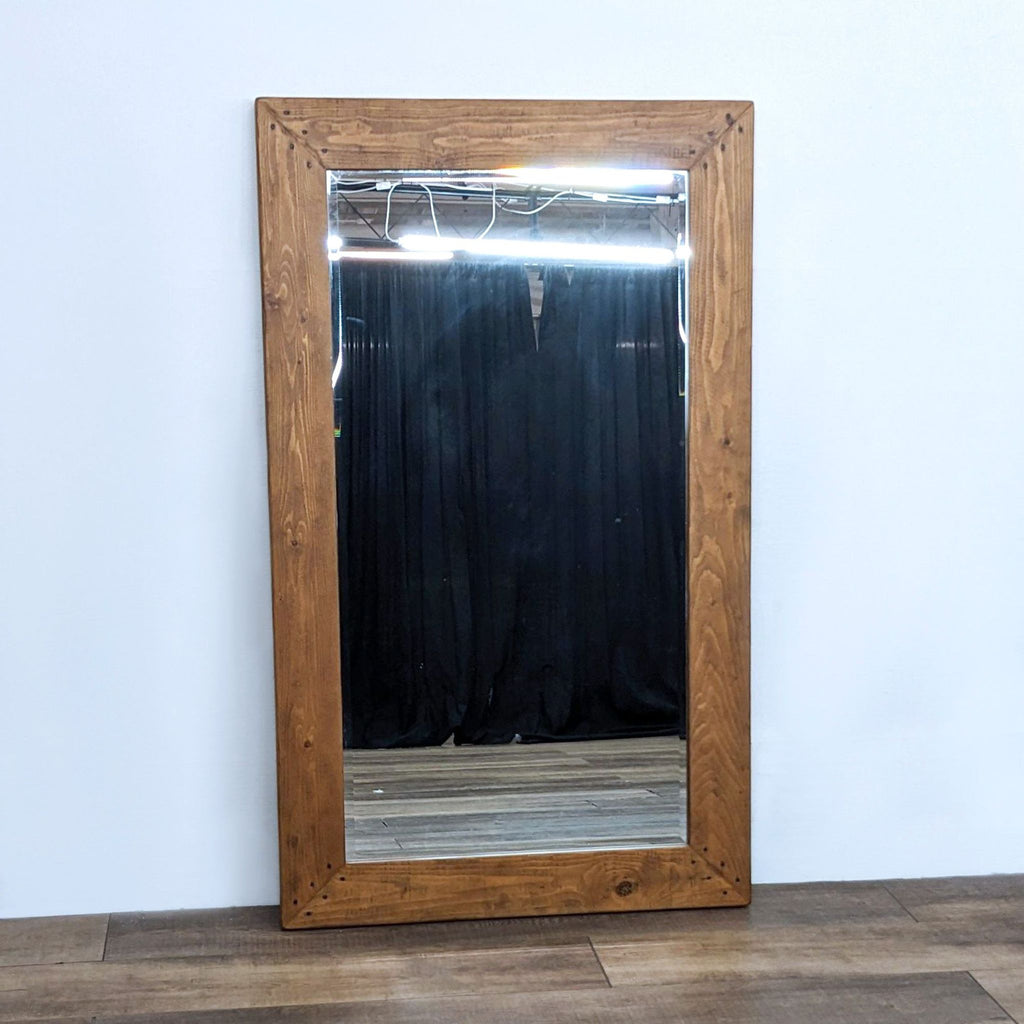 Rustic rectangular mirror with beveled edge, by Pottery Barn.