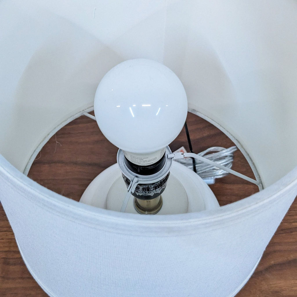 Top view of Reperch lamp showing the bulb and interior of the shade.