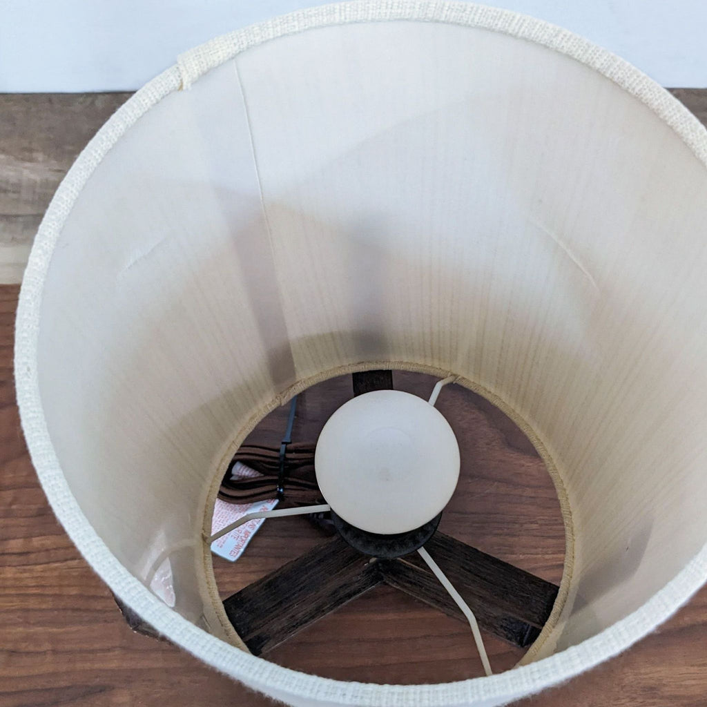 Top view of Reperch lamp showing the light bulb inside the cylindrical shade.