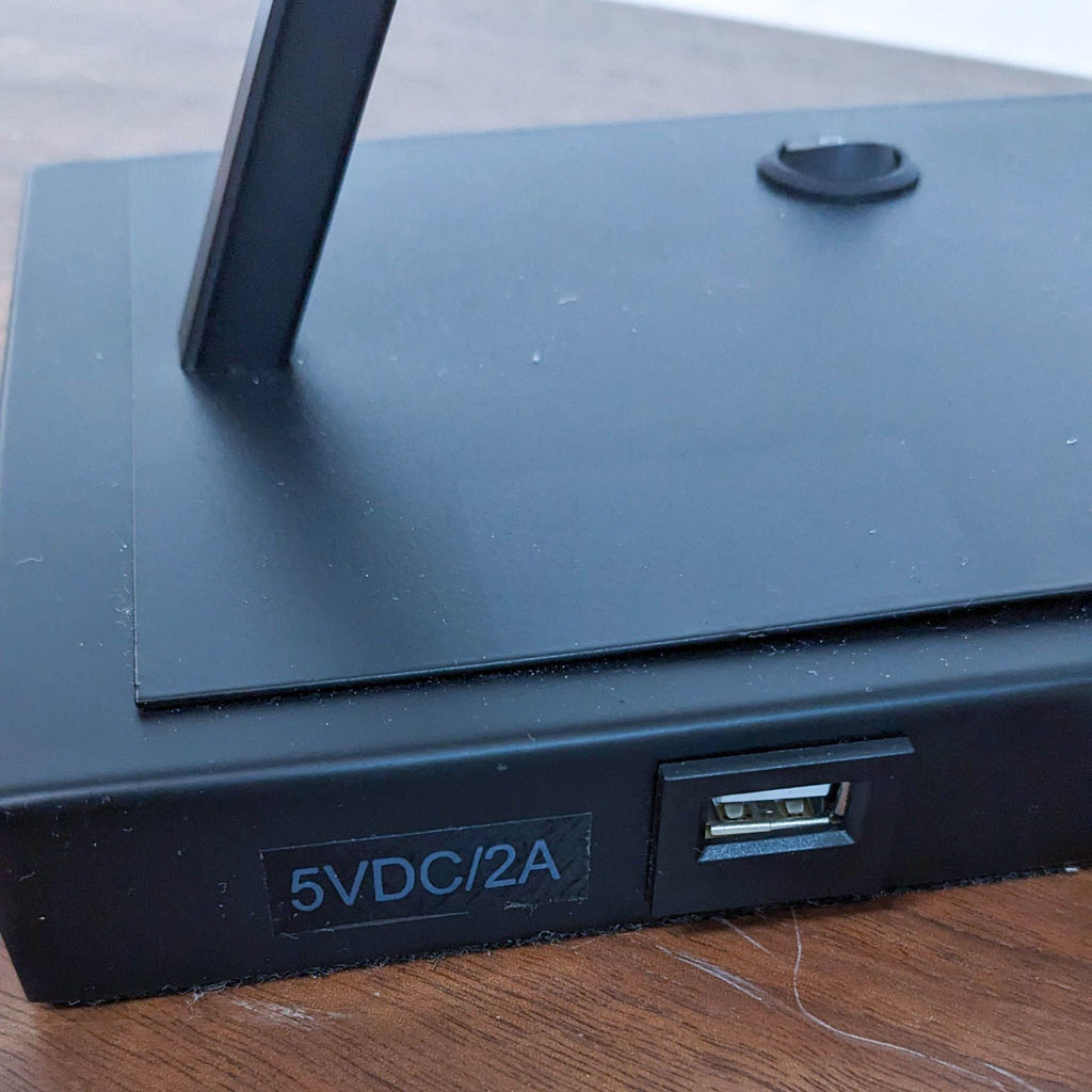 Close-up of the lamp base featuring a USB port for charging.
