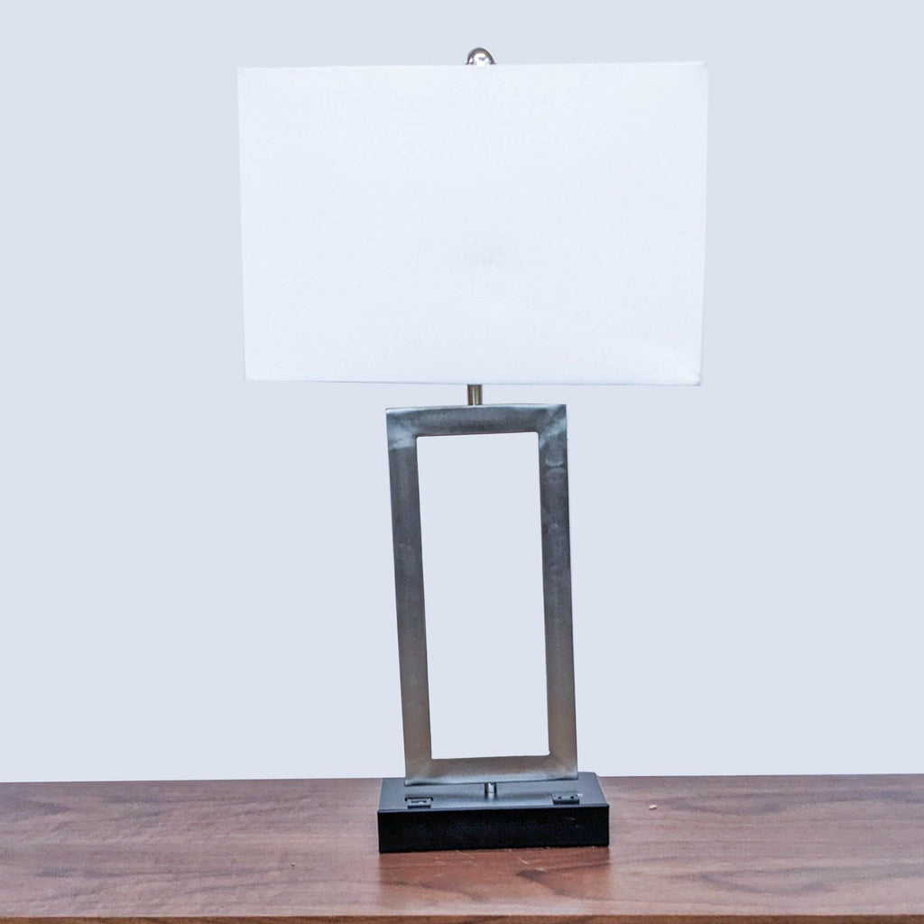Modern table lamp with rectangular frame and white shade by Reperch.