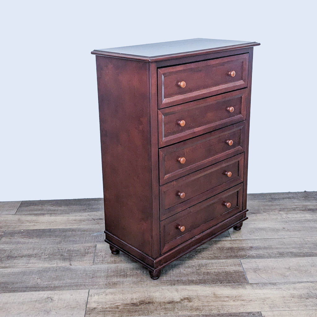 Angled view of the Palisades dresser by Europa Baby, highlighting its rich finish and classic design.