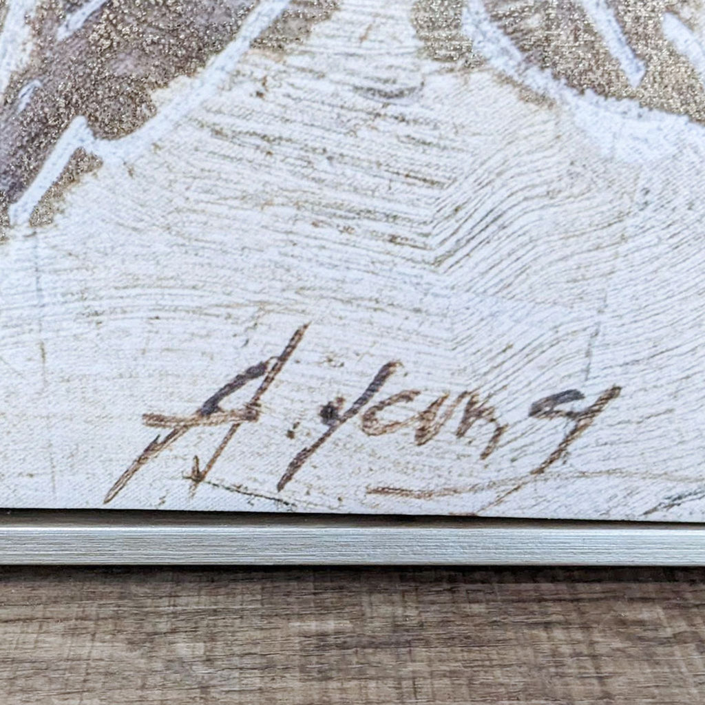 Close-up of the artist's signature on the painting.