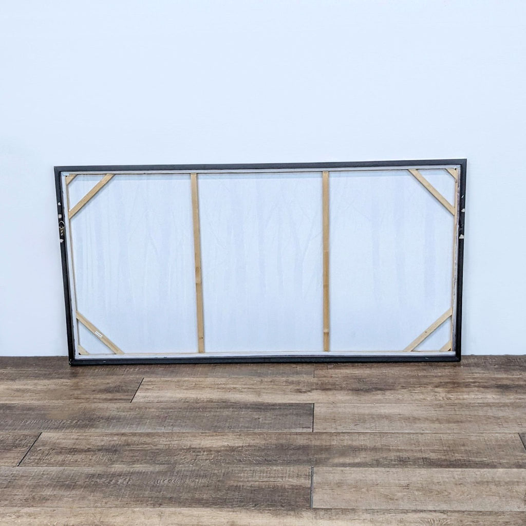 Back view of framed aspen tree canvas, highlighting the frame and support structure.