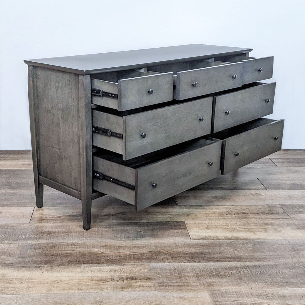 Side angle showing the dresser with open drawers, revealing ample storage.