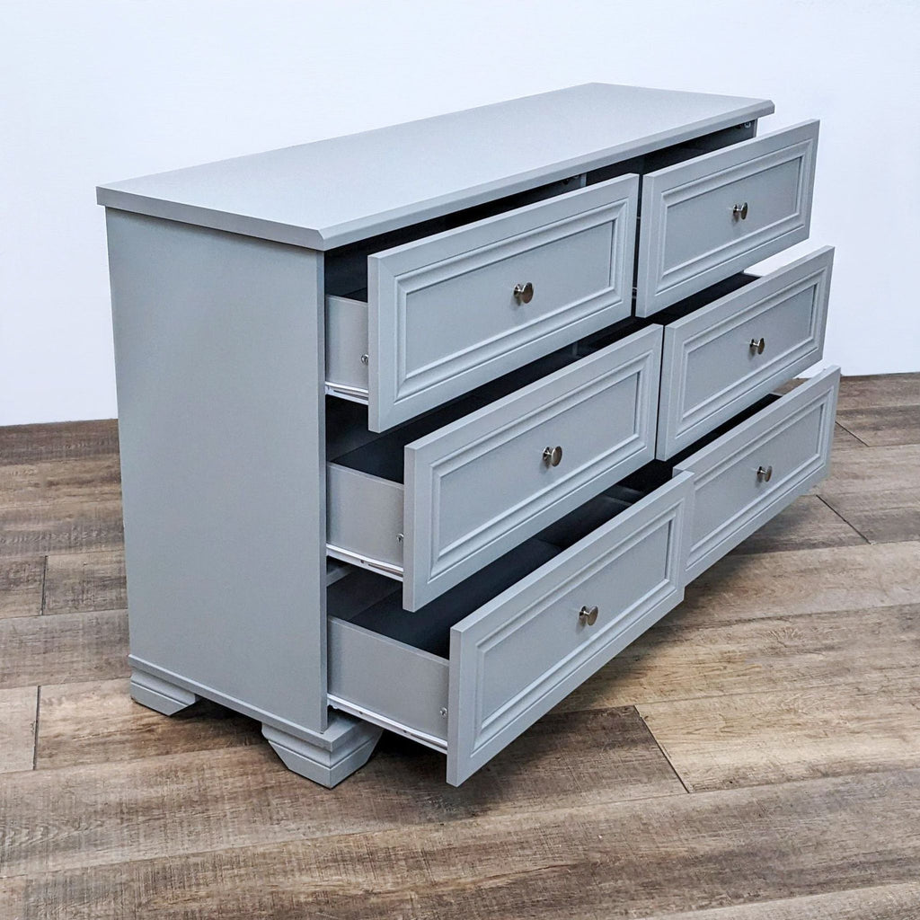 Side view of Southlake dresser, drawers open, winter gray finish.