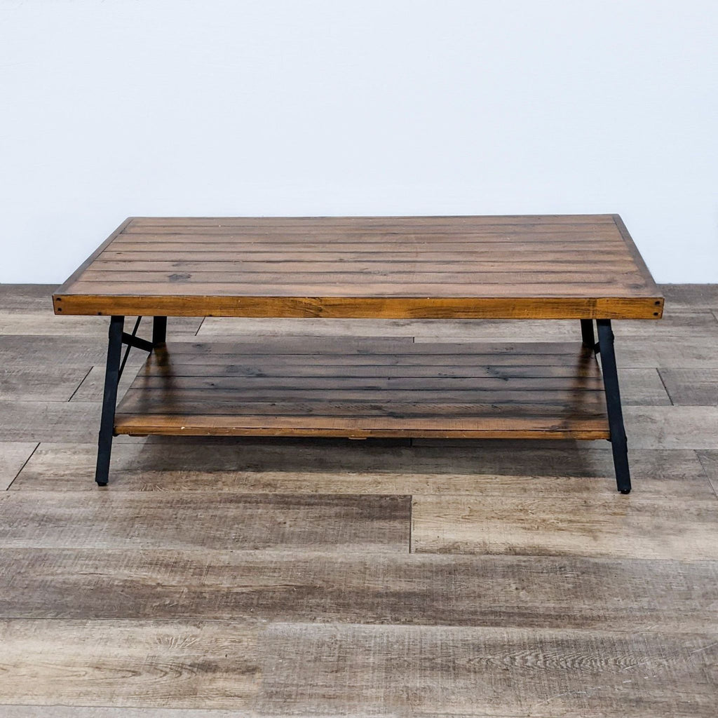 Rustic wood and steel coffee table with open shelf.