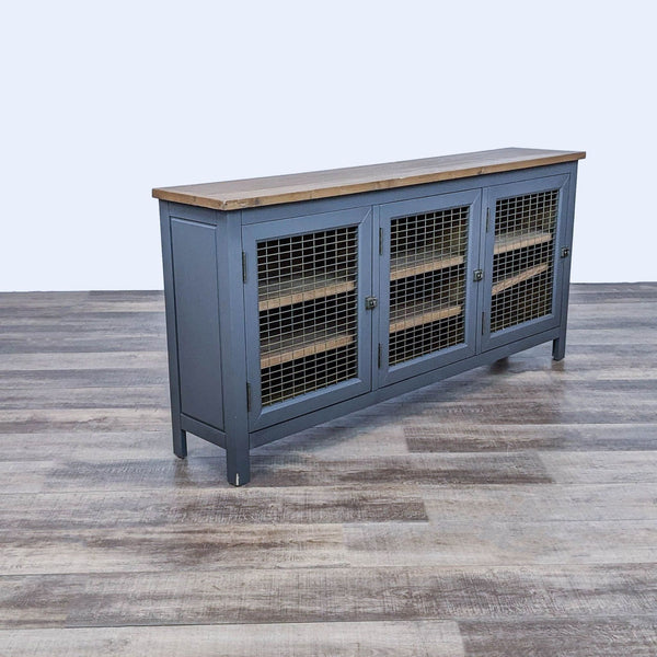 Industrial cabinet with mesh doors, wood top, and shelving by Reperch.