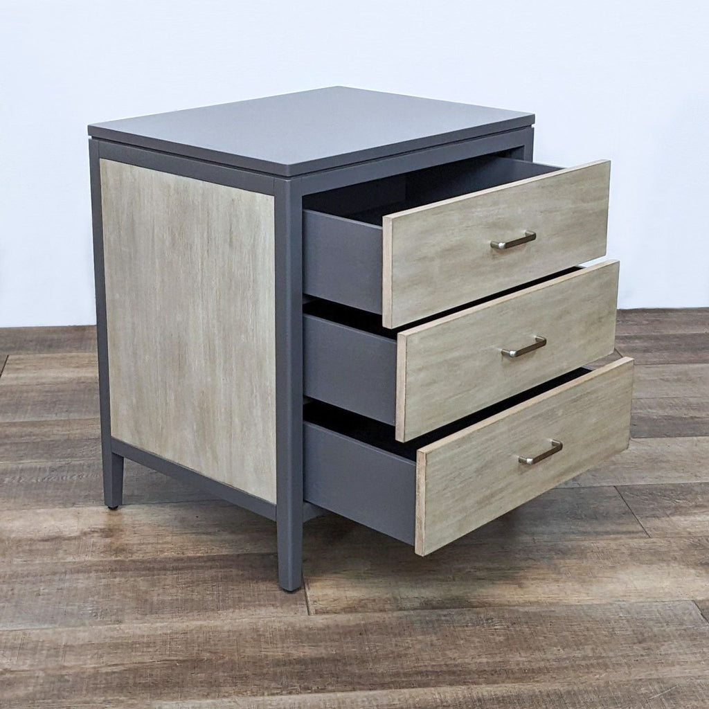 Alt text 2: Open drawer view of Ballard Designs end table, highlighting handmade sandblasted veneers and inset sides, against wood floor backdrop.