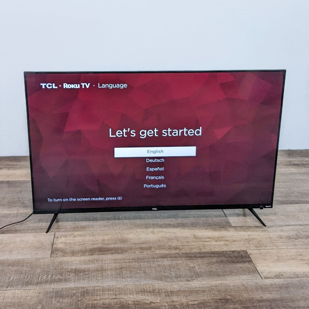 Setup screen on a TCL Roku TV prompting language selection.