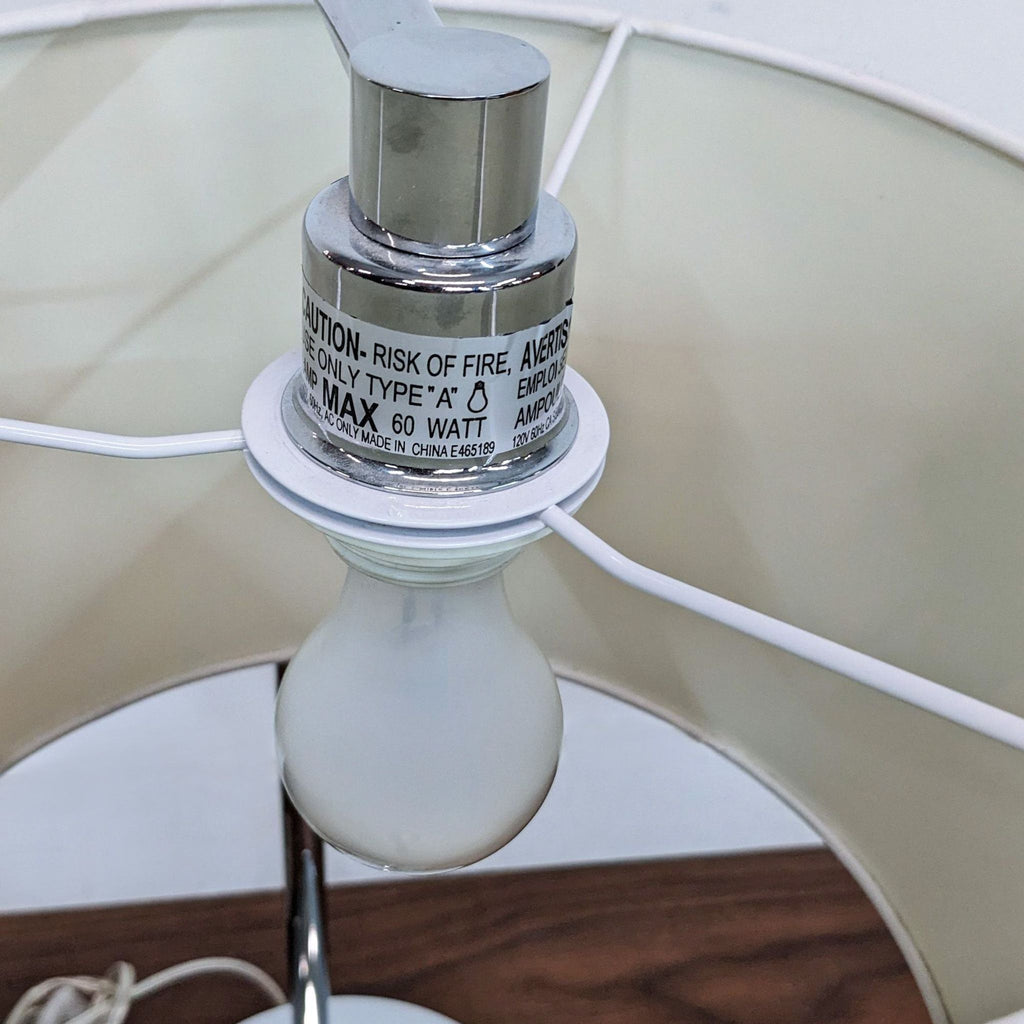 Close-up of Reperch lamp's bulb and fitting details.