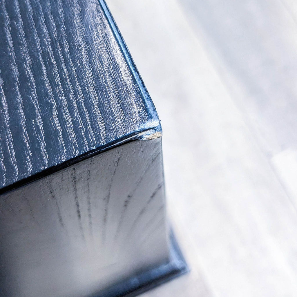 Close-up of the cabinet's corner detailing and finish.