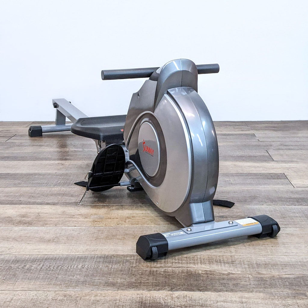 2. Sunny brand exercise rower with black seat and digital display, rear view.