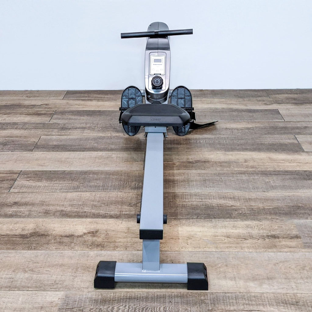 3. Front view of a Sunny rowing machine with foot straps and long sliding rail.