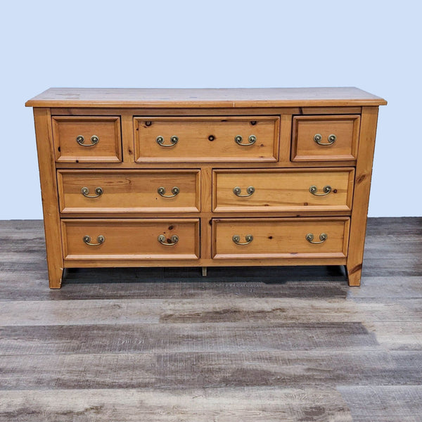 Reperch dresser in honey-brown with seven drawers and antique pulls.