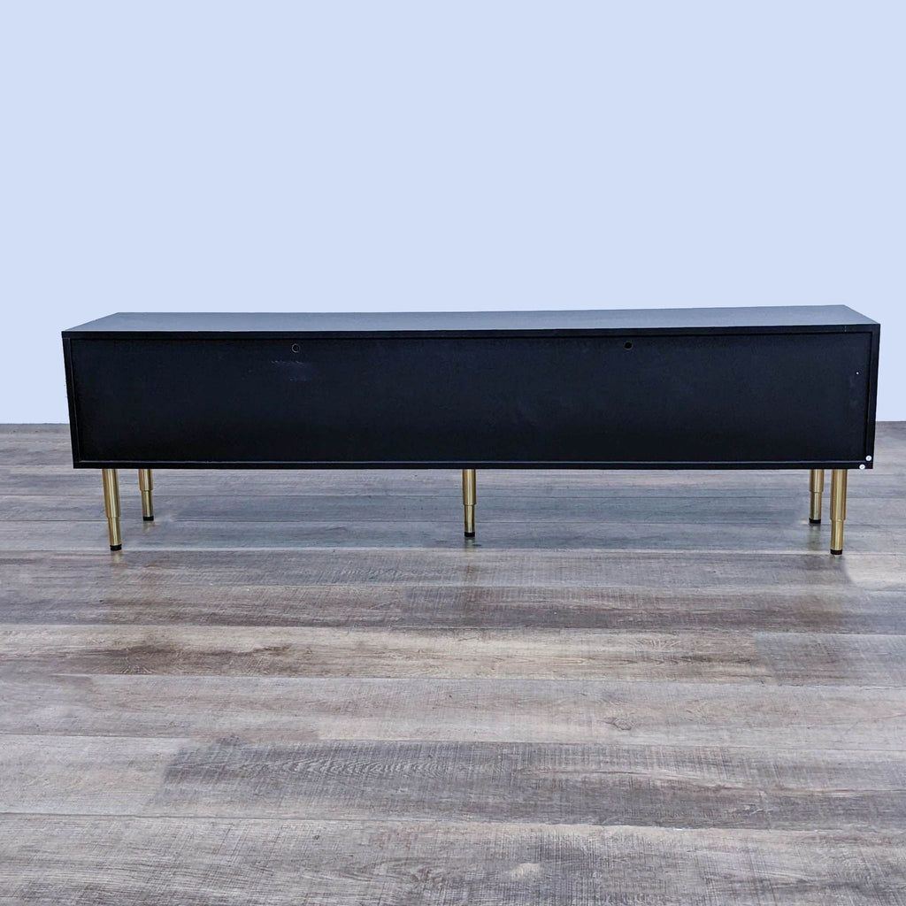 Back view of the Mercer41 entertainment center with gold metal feet and sleek design.