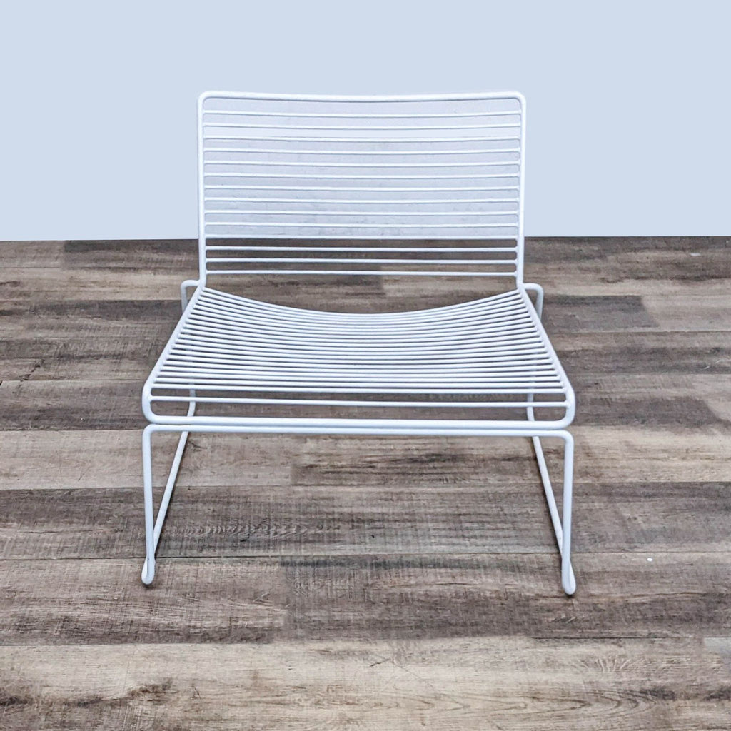Hee Modern Lounge Chair with wide, low seat and powder-coated steel frame.