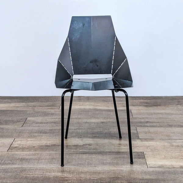 Front view of a modern, angular dining chair in black steel.  
