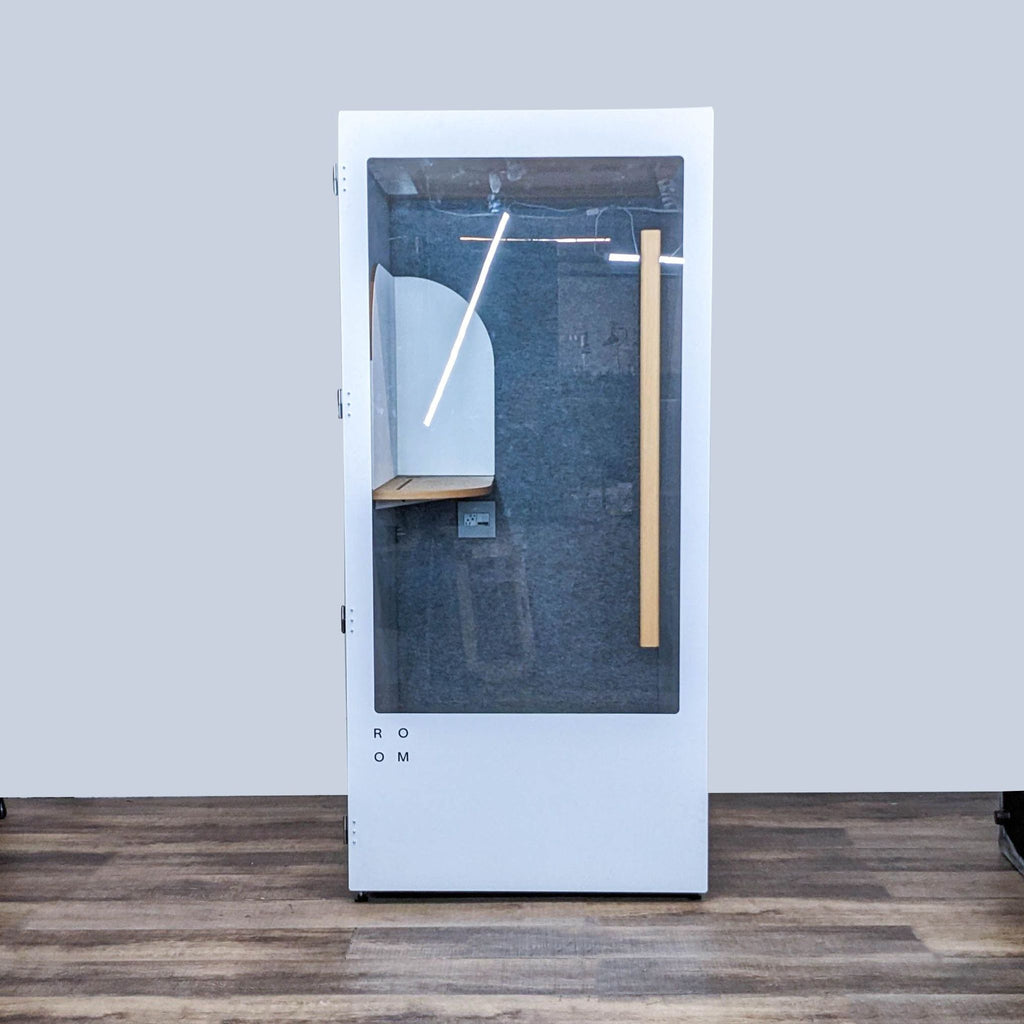the door is a glass door with a wooden handle.