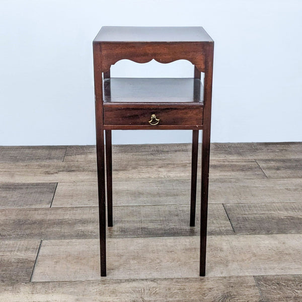 Side table with scalloped apron and metal hardware by Reperch.