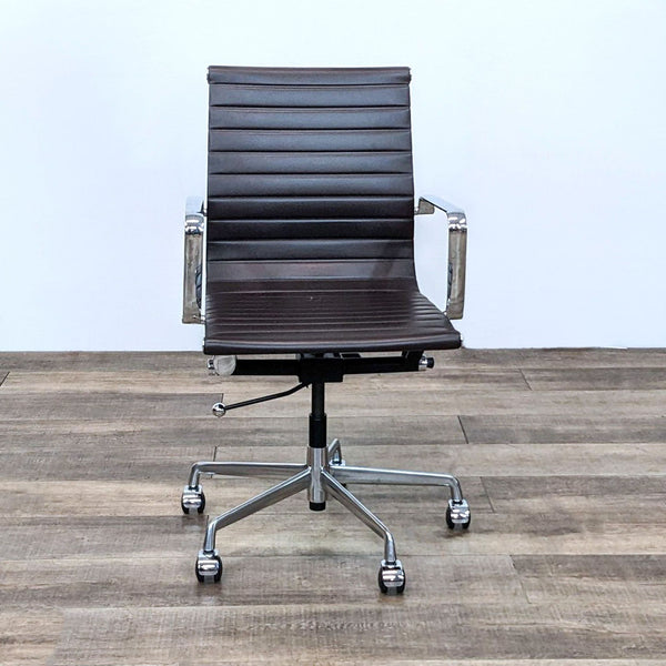 Brown ribbed faux leather office chair with chrome armrests and base.