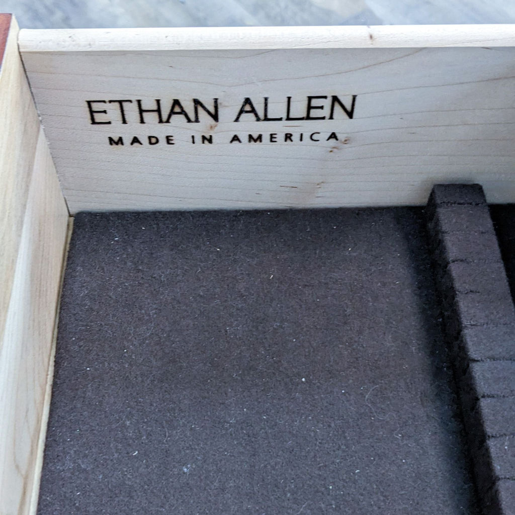 Close-up of drawer with "Ethan Allen Made in America" branding.