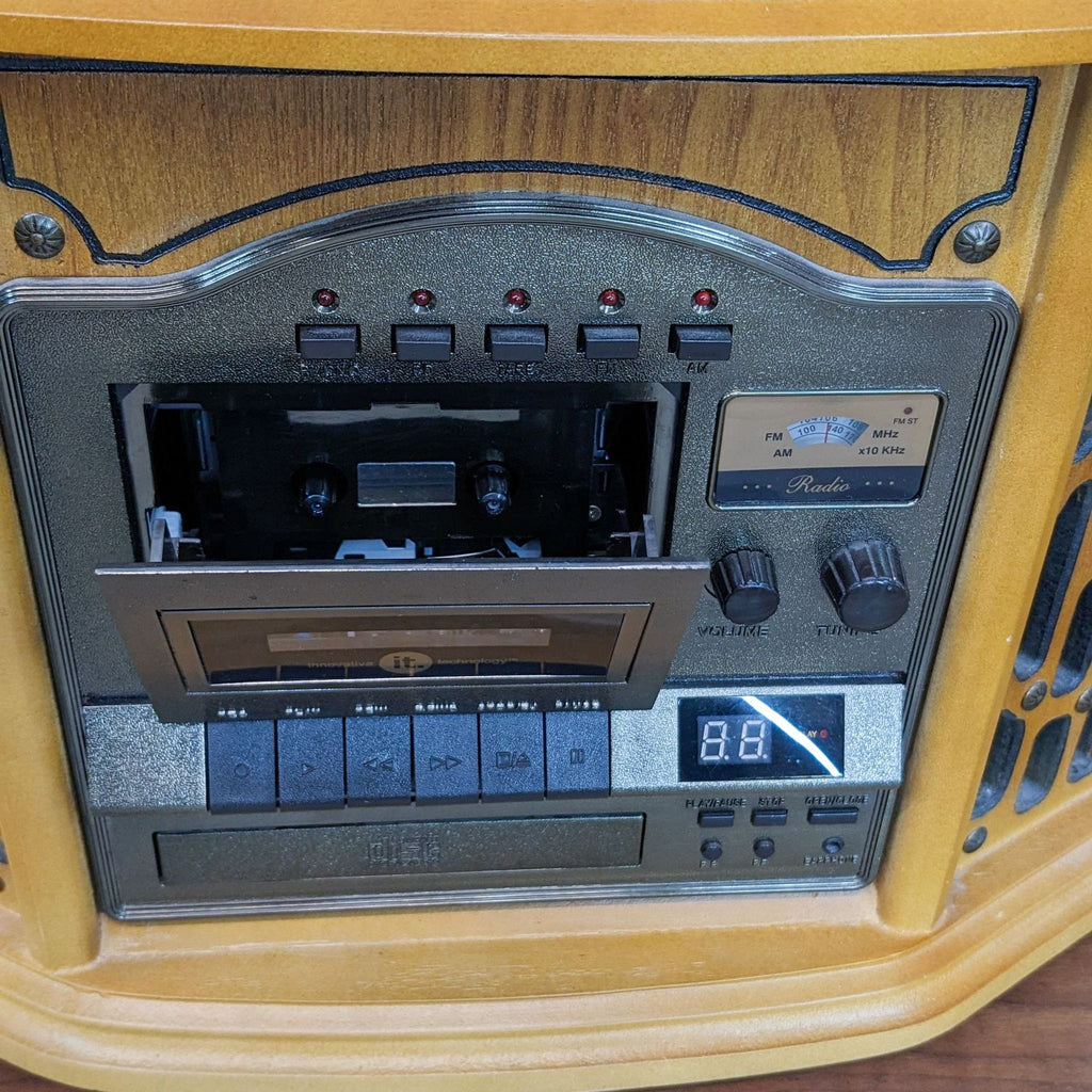 Front of music center showing cassette player, radio, and control buttons in a wooden finish.