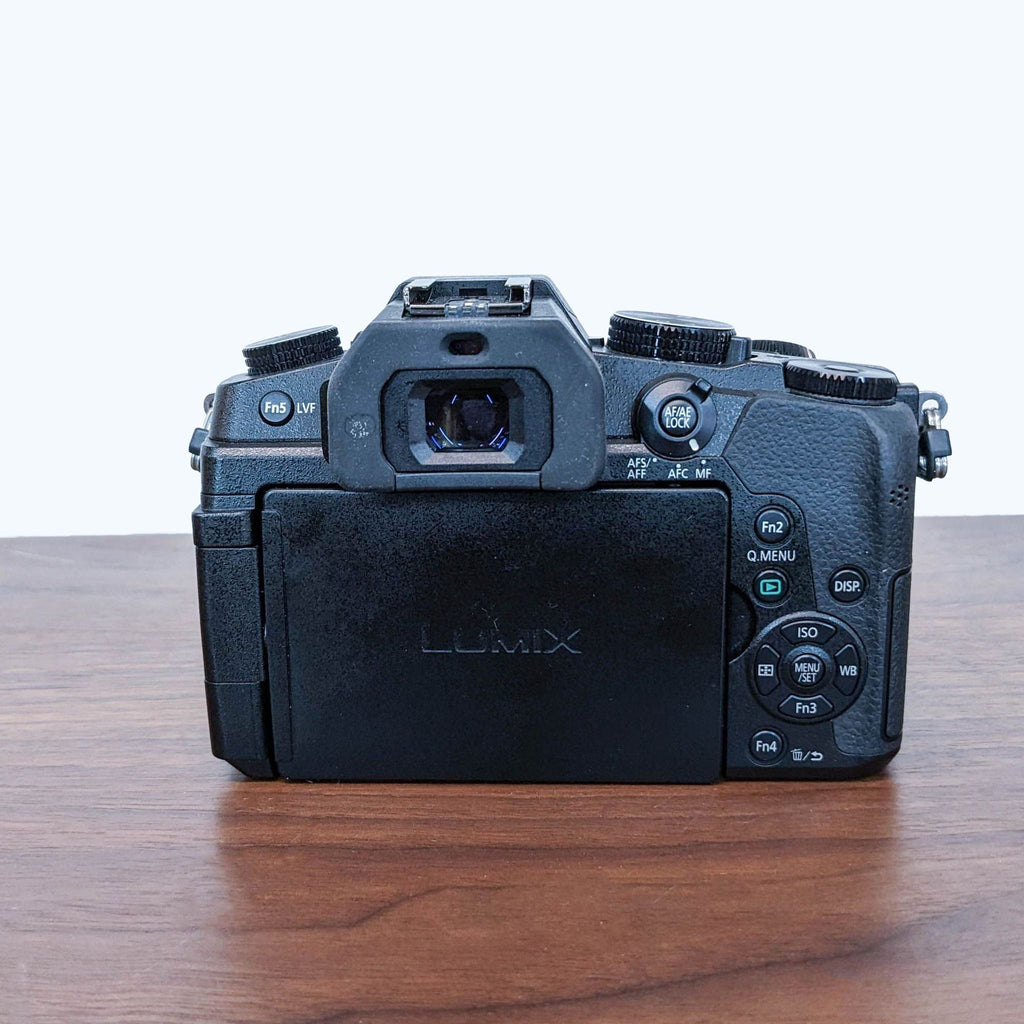 Rear view showing controls and viewfinder of a Panasonic LUMIX G Mirrorless Camera body.