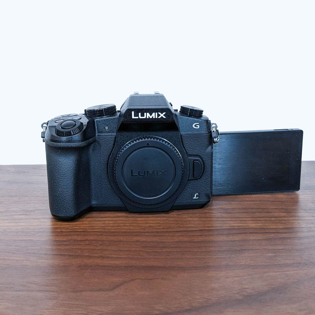 Front view of a Panasonic LUMIX G Mirrorless Camera with the side screen extended.