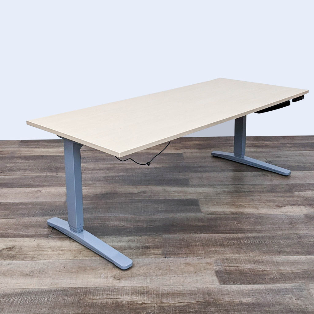 Six-foot adjustable office desk with large workspace, ideal for multiple monitors, Uplift brand.