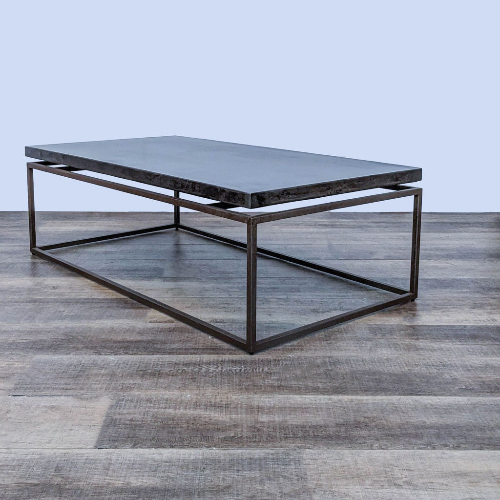 An all-metal coffee table by Reperch, featuring a floating top design.