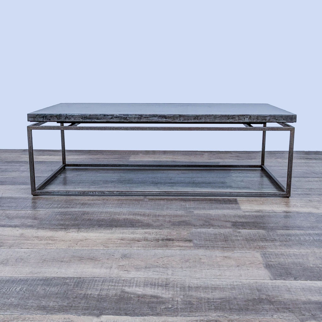 Reperch metal coffee table with suspended top, displayed on wooden floor.