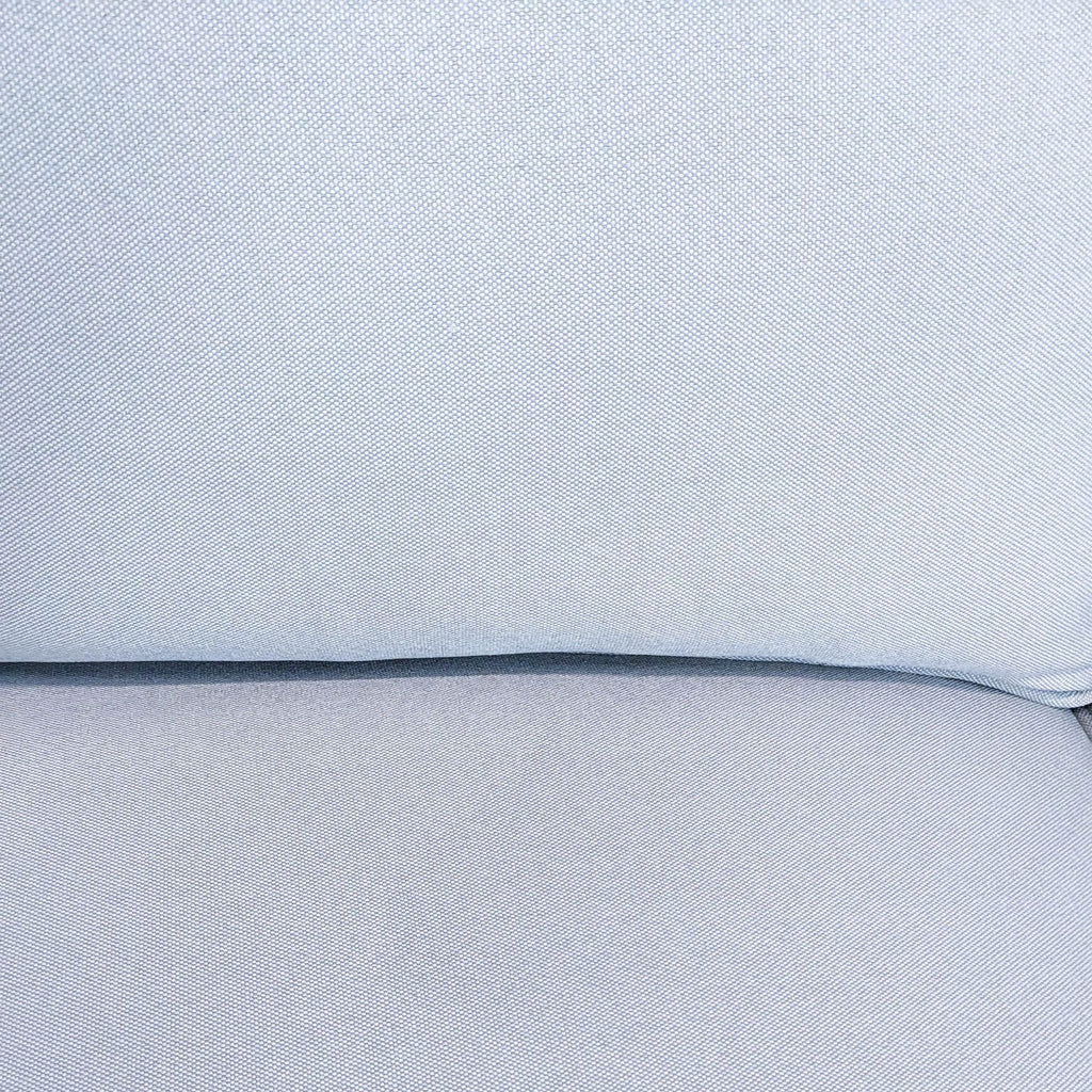 Close-up of gray fabric texture on a Reperch 3-seat sofa with stitch detailing and cushion seams.