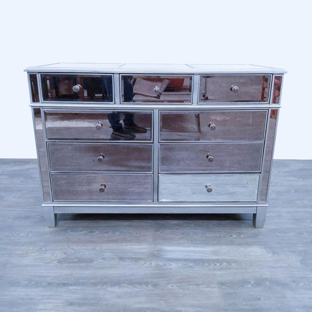Front view of the Hayworth dresser with mirrored drawers and silver frame.