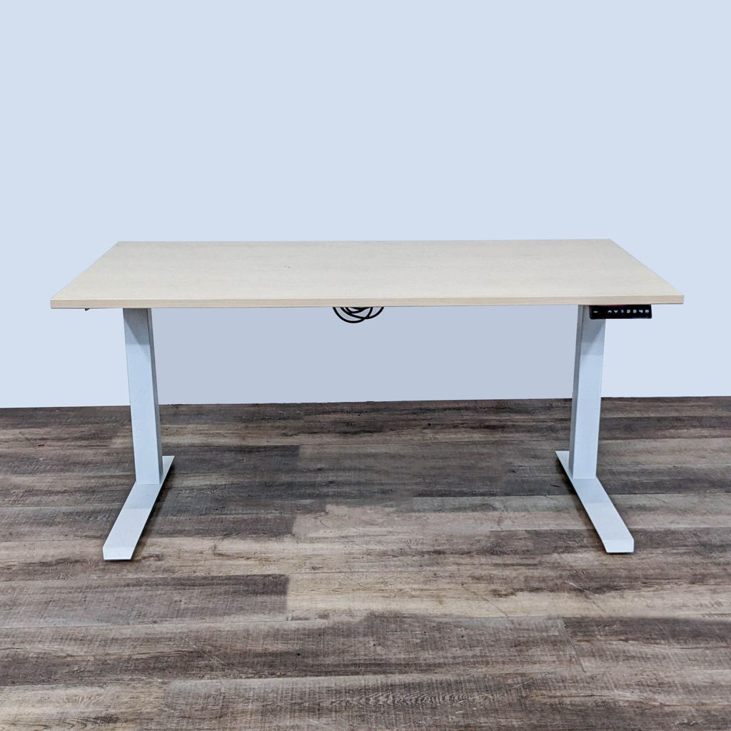 Oak finish electric standing desk with dual-motor lift and control panel for ergonomic use. AMQ brand.