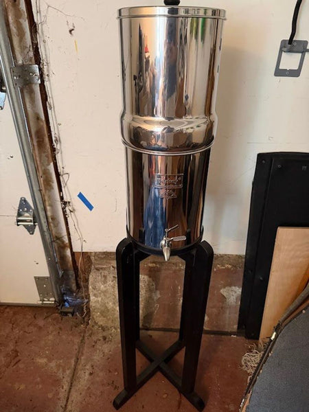 Stainless steel Berkee water purifier in excellent condition, pictured on a countertop.