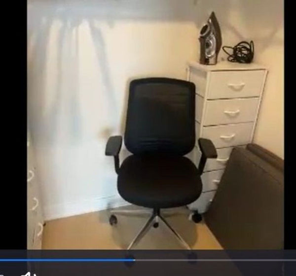 1. Reperch office chair with mesh back, armrests, and wheels, placed in a small room next to white drawers.