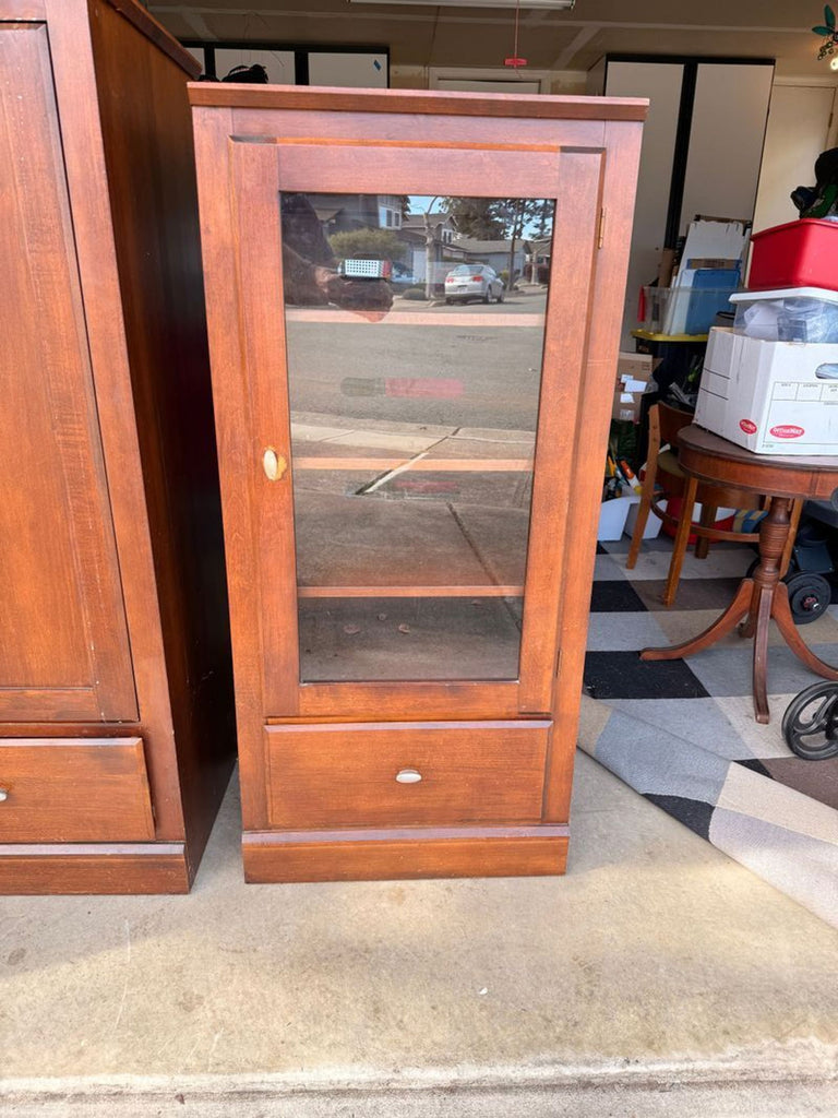 Ethan Allen solid wood cabinet with a classic design, featuring sturdy construction and natural wood grain.  