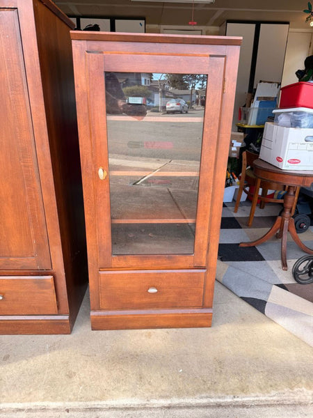 Ethan Allen solid wood cabinet with a classic design, featuring sturdy construction and natural wood grain.  